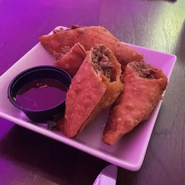Oxtail empanadas with dipping sauce at Carib Soul BK