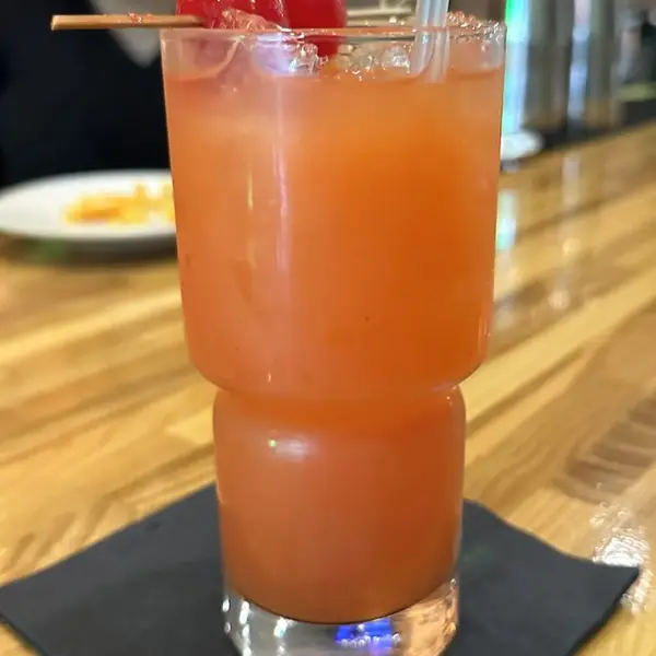 Carib Soul BK rum punch garnished with a cherry