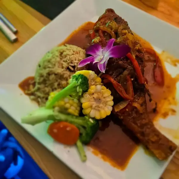 Steamed fish with corn, broccoli and rice and peas at Carib Soul BK